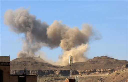 In this photo take on Friday, April 17, 2015, smoke rises after a Saudi-led airstrike on Sanaa, Yemen. Iran's foreign minister urged U.N. Secretary-General Ban Ki-moon on Friday to try to end "the senseless aerial attacks" in Yemen by a Saudi-led coalition and establish a cease-fire. 