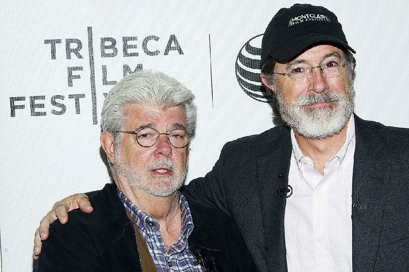 George Lucas, left, and Stephen Colbert attend the Tribeca Talks: Director Series during the Tribeca Film Festival at the BMCC Tribeca Performing Arts Center on Friday, April 17, 2015, in New York. 