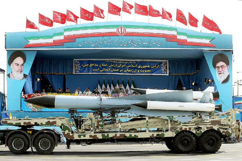 The Iranian army puts missiles on display in a military parade Saturday marking National Army Day in front of the mausoleum of the late revolutionary founder Ayatollah Ruhollah Khomeini, just outside Tehran. 