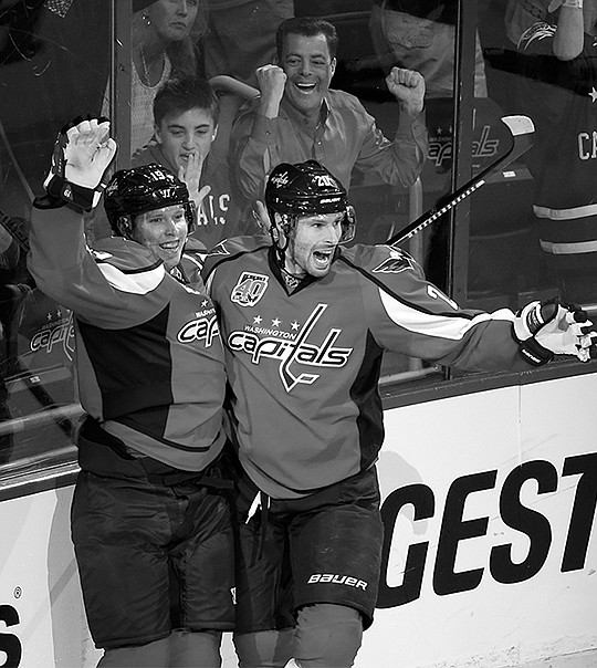The Associated Press BACKSTROM BOYS: Washington Capitals center Nicklas Backstrom, left, and right wing Troy Brouwer celebrate Backstrom's goal against the New York Islanders during the third period of Game 2 in the first round of the Stanley Cup playoffs Friday in Washington. The Capitals won 4-3, rallying from a 3-1 deficit behind Backstrom's goal and two assists. The series is tied at a game apiece.