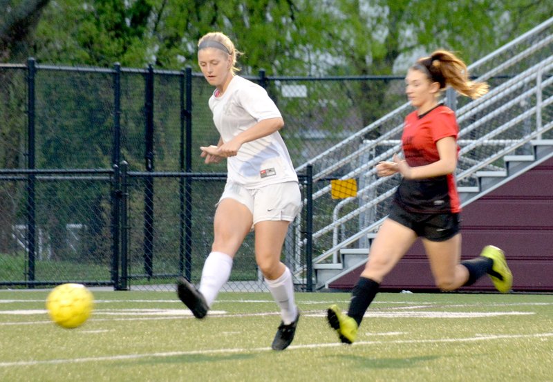 Graham Thomas/Siloam Sunday Siloam Springs senior Annika Bos passes the ball before a Russellville player is able to converge on the play Tuesday at Panther Stadium. The Lady Panthers defeated Russellville 1-0.