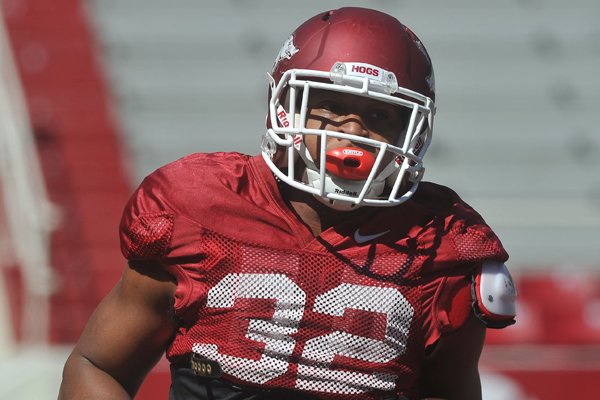 Arkansas running back Jonathan Williams runs drills during practice Saturday, April 4, 2015, at Razorback Stadium in Fayetteville.