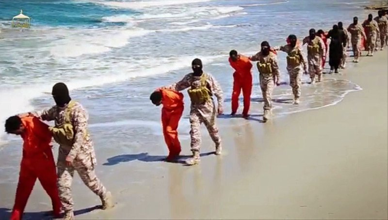 More slayings: This undated image made from a video released by Islamic State militants, Sunday shows a group of captured Ethiopian Christians taken to a beach before they were killed by Islamic State militants, in Libya.
