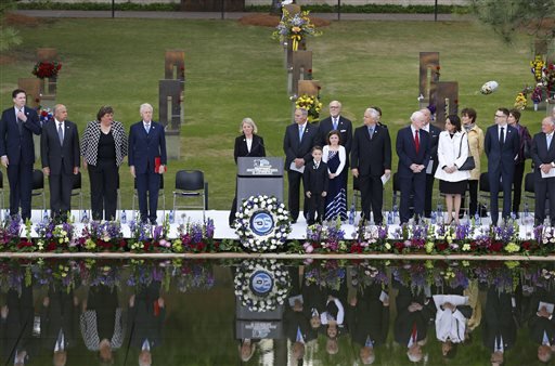 Speakers, including former President Bill Clinton, fourth from left, stand at the opening of ceremonies to commemorate the 20th anniversary of the Oklahoma City bombing, at the Oklahoma City National Memorial, in Oklahoma City, Sunday, April 19, 2015.