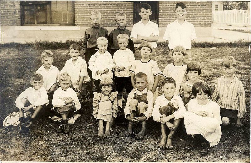 Nine sets of twins, ages 7-12, posed outside the former Clendenin School in North Little Rock for this Nov. 4, 1924, picture. The two tallest boys in the back row are Ben Quinney (arms crossed) and Glen Quinney. The other children are unidentified so far.