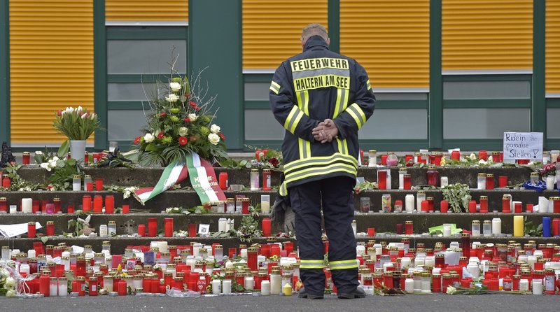 A firefighter visits a memorial at the Joseph-Koenig high school in Haltern, Germany, in March. Sixteen students and two teachers from the school died in a Germanwings crash in the French Alps caused by the fl ight’s co-pilot.