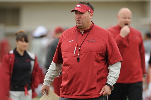 Arkansas head coach Bret Bielema speaks to his players during practice Saturday, April 18, 2015, at the university's practice facility in Fayetteville.