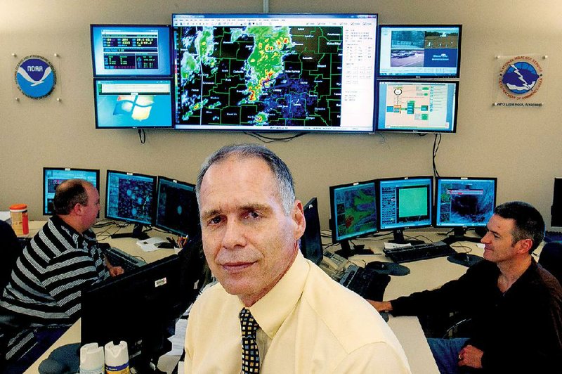 Arkansas Democrat-Gazette/BENJAMIN KRAIN --04/20/2015--
Steve Drillette is the new Meteorologist in Charge at the National Weather Service's North Little Rock office. He is seen here with staff in the operations station where he is in charge of monitoring weather patterns.