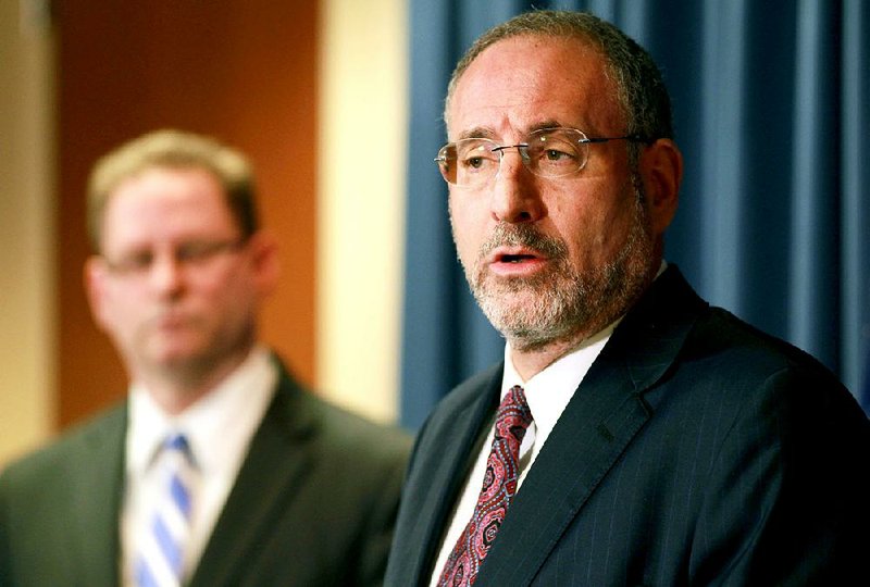 United States Attorney Andrew Luger, right, and FBI special agent Richard Thornton explain the criminal complaint charging six Minnesota men with terrorism at a news conference in Minneapolis, Monday April 20, 2015. The six, whom authorities described as friends who met secretly to plan their travels, are accused of conspiracy to provide material support and attempting to provide material support to a foreign terrorist organization. The complaint says the men planned to reach Syria by flying to nearby countries from Minneapolis, San Diego or New York City, and lied to federal investigators when they were stopped. (AP Photo/Andy Clayton-King)