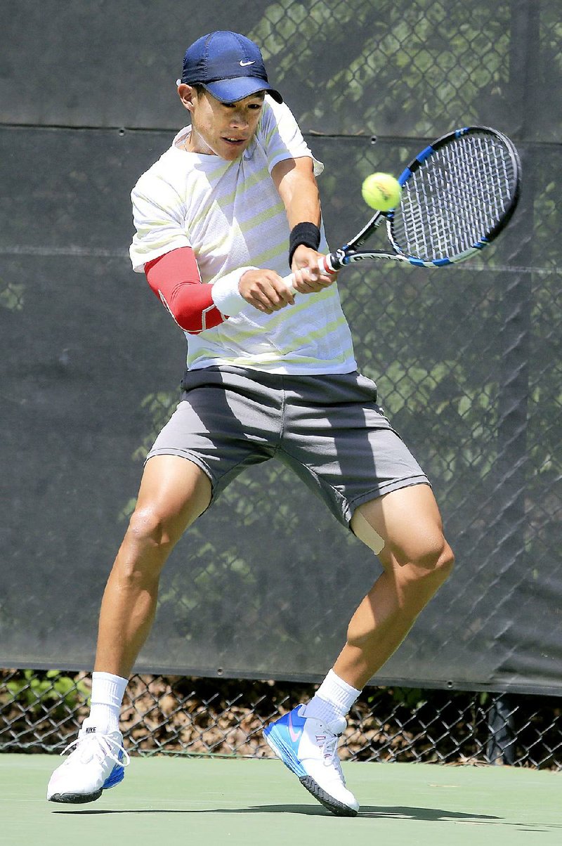 Arkansas Democrat-Gazette/RICK MCFARLAND --04/19/15--  Jason Jung, of California, hits a backhand shot during his finals match with  Darian King, of Barbados, in the USTA Pro Circuit Men's Futures Tournament at Pleasant Valley Country Club in Little Rock Sunday.