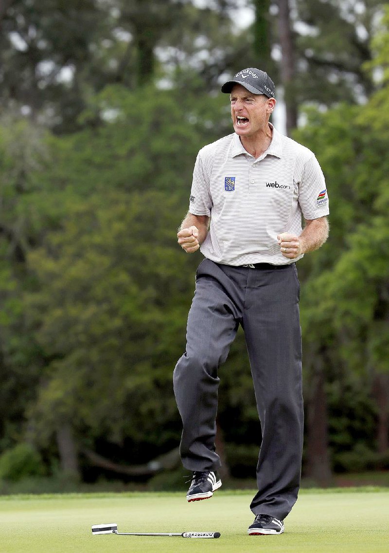 Jim Furyk reacts after his winning putt on the 17th hole against Kevin Kisner during the playoff of the RBC Heritage golf tournament in Hilton Head Island, S.C., Sunday, April 19, 2015. Furyk beat Kisner in a playoff. (AP Photo/Stephen B. Morton)