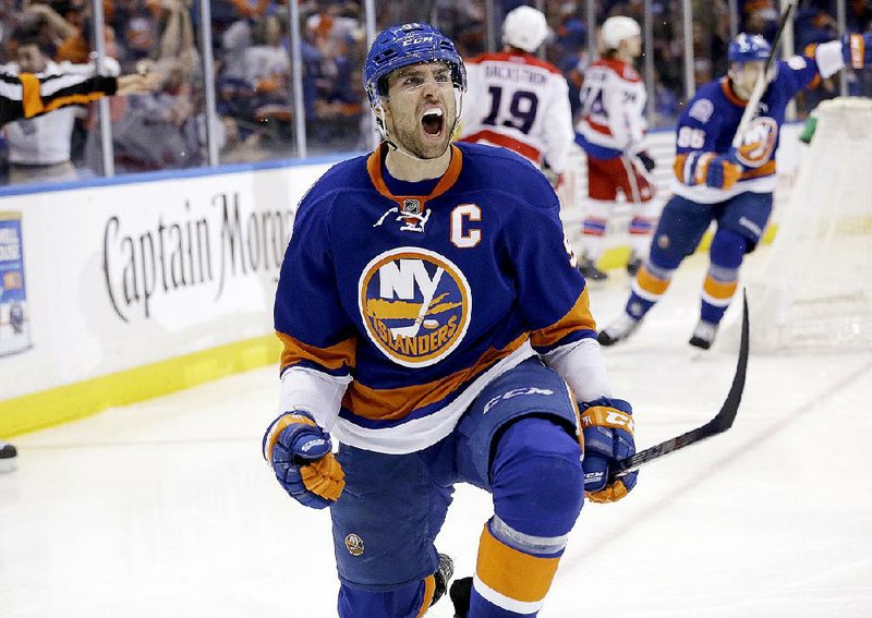 New York Islanders' John Tavares reacts after scoring the winning goal during the overtime period of Game 3 of a first-round NHL hockey playoff series against the Washington Capitals Sunday, April 19, 2015, in Uniondale, N.Y. The Islanders defeated the Capitals 2-1. (AP Photo/Seth Wenig)