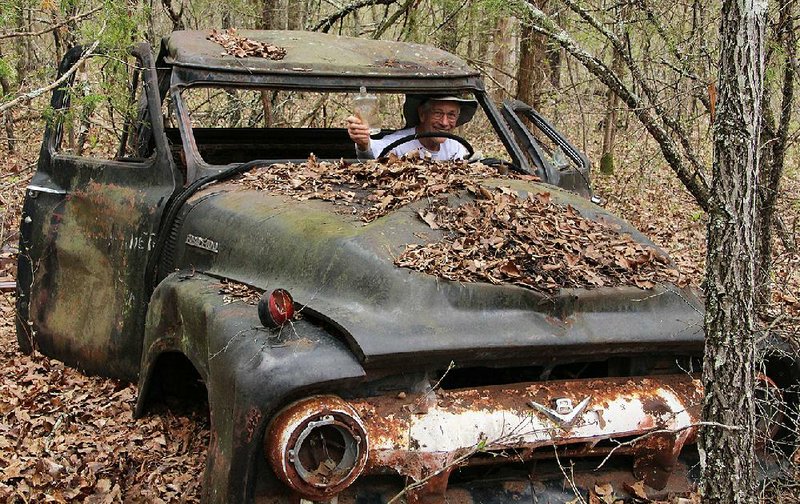 Special to the Democrat-Gazette/BOB ROBINSON
Bill Steward of Sherwood, retired from the mining supply business, finds an artifact from a distant time in an F-100 parked near Cow Creek among a cluster of equally well maintained vehicles in the Lower Buffalo Wilderness.