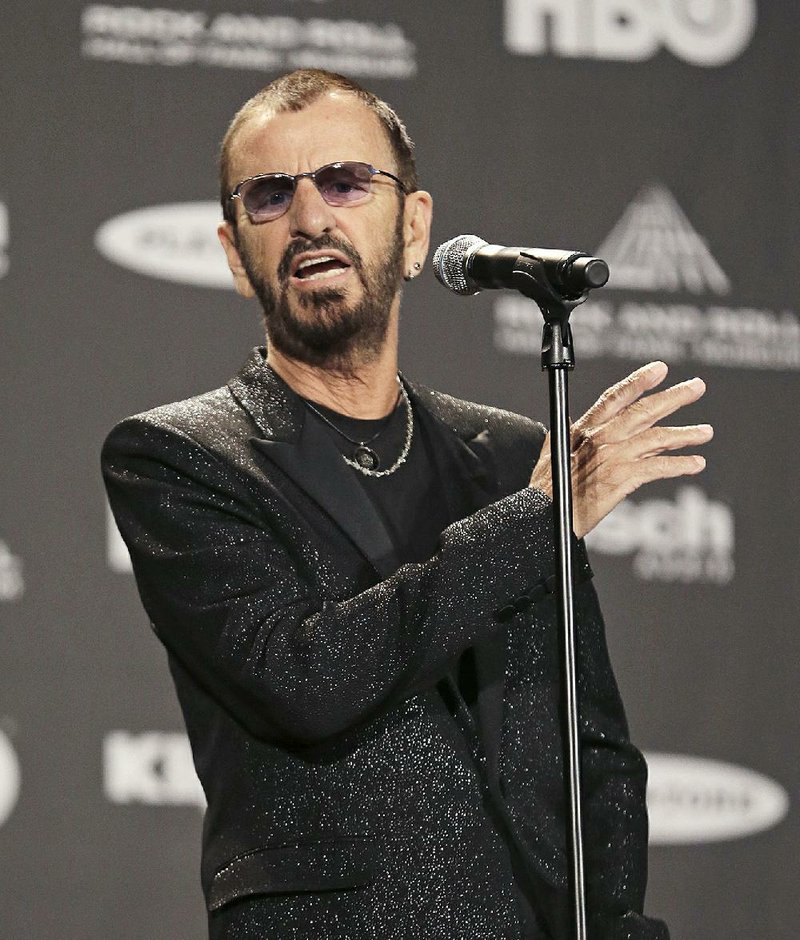 Ringo Starr answers questions at the Rock and Roll Hall of Fame Induction Ceremony Saturday, April 18, 2015, in Cleveland. (AP Photo/Tony Dejak)