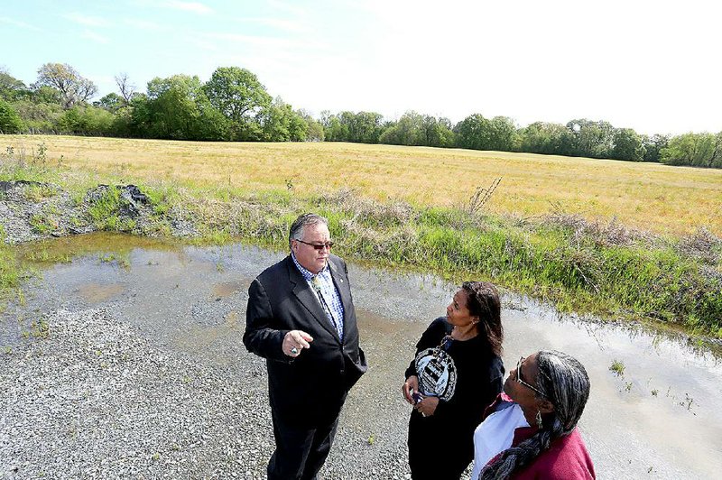 Arkansas Democrat-Gazette/RICK MCFARLAND --04/14/15--    John Berrey, chairman Quapaw tribe, with Tamela Tenpenny-Lewis (center) and Carla Coleman, both with Preservation of African-American Cemetaries, near the 160 acres that the Quapaw tribe owns on Thibault Rd. in Pulaski County Tuesday. A Quapaw burial site also contains graves of slaves.