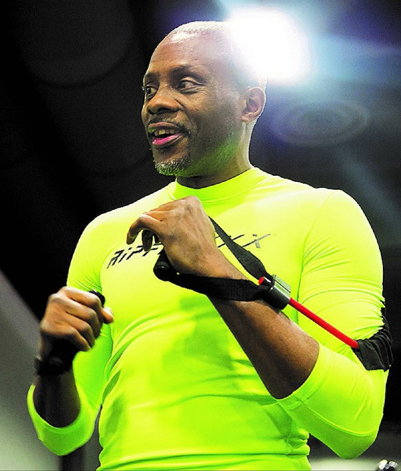 Former world boxing champ Keith Holmes created the RS-1, an exercise shirt that has resistance bands sewn into it. Illustrates HEALTH-EXERCISE-SHIRT (category l), by Vicky Hallett, (c) 2015, The Washington Post. Moved Thursday, February 26, 2015. (MUST CREDIT: Sammy Mayo Jr.)