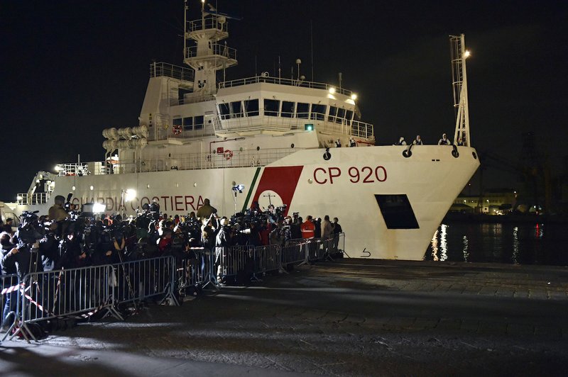 Italian Coast Guard ship Bruno Gregoretti, carrying survivors of the boat that overturned off the coasts of Libya Saturday, arrives at Catania Harbor, Italy, Monday, April 20, 2015. A smuggler's boat crammed with hundreds of people overturned off Libya's coast as rescuers approached, causing what could be the Mediterranean's deadliest known migrant tragedy and intensifying pressure on the European Union Sunday to finally meet demands for decisive action.