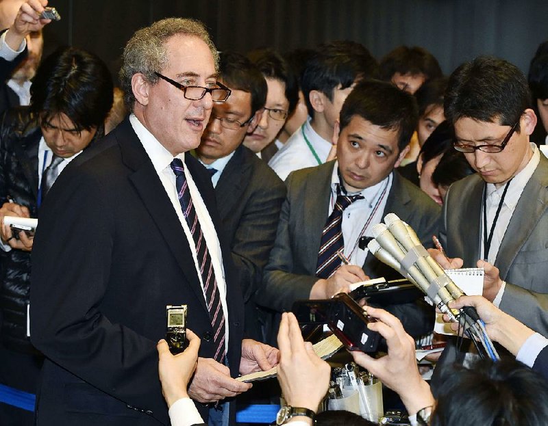 U.S. Trade Representative Michael Froman (left) speaks to reporters Tuesday after concluding talks with a Japanese counterpart in Tokyo. 