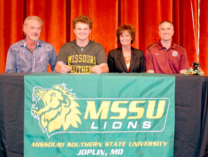 Graham Thomas/Herald-Leader Siloam Springs senior golfer Brandon Coale, third from left, signed a letter of intent on Thursday of last week to play golf at Missouri Southern State University in Joplin, Mo. Also pictured are, from left, father Jim Coale, mother Vida Thomas and Siloam Springs golf coach Michael Robertson.