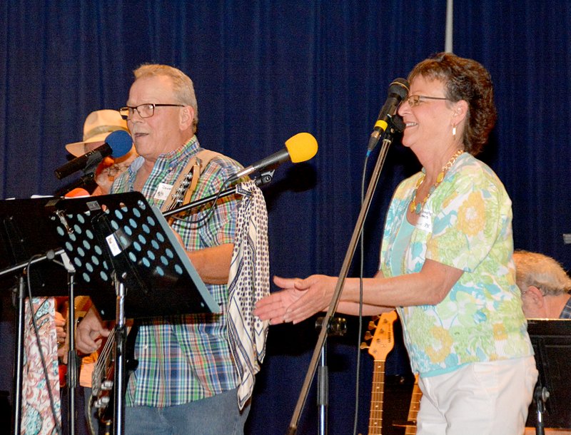 Janelle Jessen/Herald-Leader Donald Gray, class of 1971, and Karen Thompson Williams, class of 1975, sang during the reunion concert.