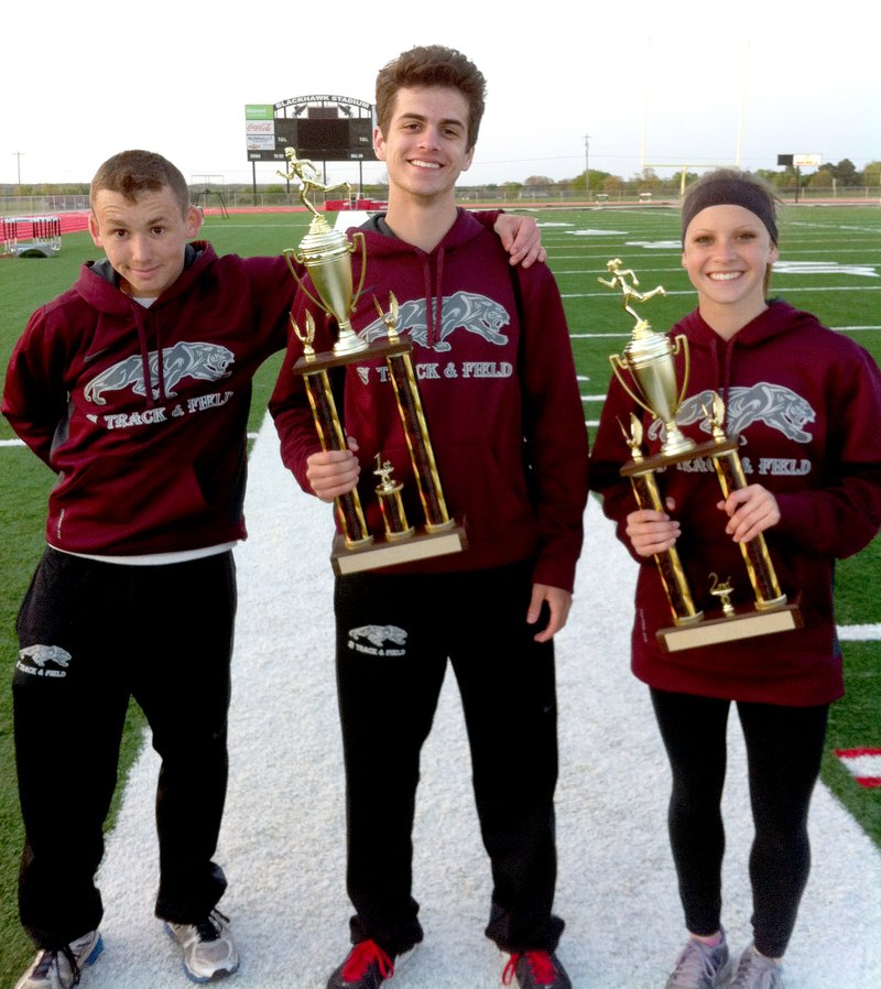 Photo submitted Siloam Springs athletes, from left, Conner Humphrey, Gavin Efurd and Taylor Gay, show off the boys first place trophy and girls second place trophy after the Pea Ridge High School Relays held Monday at Blackhawk Stadium.