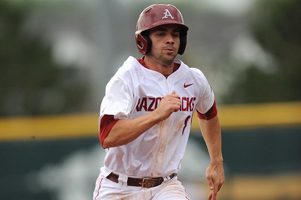 Tyler Spoon of Arkansas heads to third against Mississippi Valley State during the third inning Wednesday, April 8, 2015, at Baum Stadium in Fayetteville.