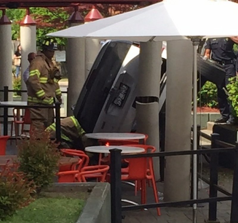 An SUV toppled onto its side on the Zaza patio Wednesday, April 22, 2015.