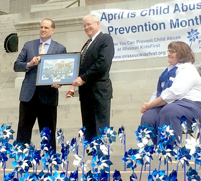 COURTESY PHOTO Shann Sievers (left), board president, Missouri KidsFirst presents Rep. Bill Lant the Standing with Children Award while Joy Oesterly, executive director, Missouri KidsFirst, looks on.