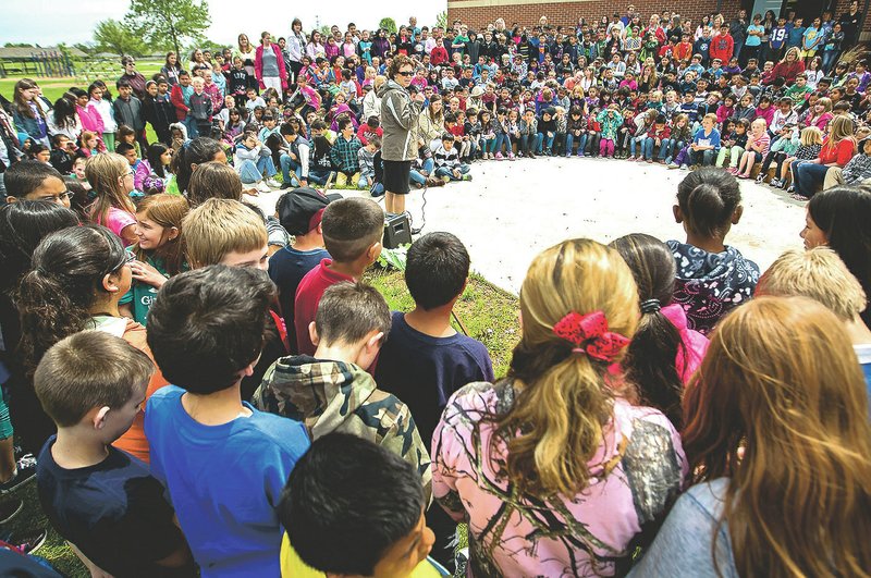 Principal Betsy Kinkade (center) speaks Wednesday during an opening ceremony for Mathias Elementary School’s outdoor classroom in Rogers. For photo galleries, go to nwadg.com/photos.