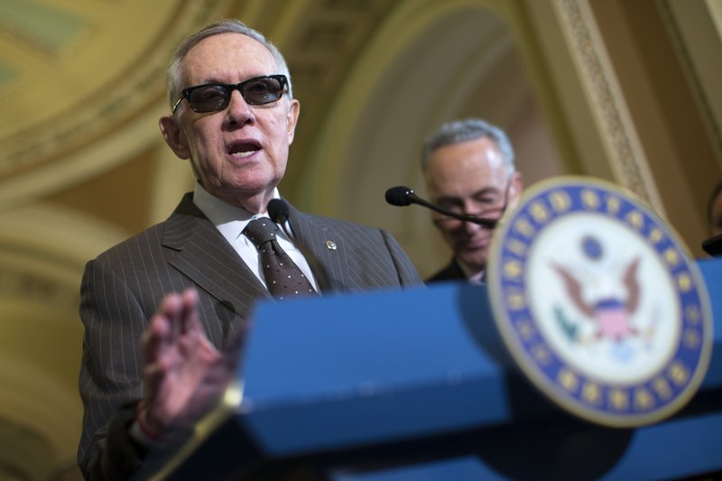 Senate Minority Leader Sen. Harry Reid of Nev., accompanied by Sen. Charles Schumer, D-N.Y., speaks during a news conference on Capitol Hill in Washington,Tuesday, April 21, 2015. Republican and Democratic lawmakers talked about putting the final touches on a human trafficking bill, and turning their attention to Attorney General nominee Loretta Lynch.