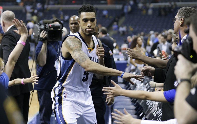 Memphis Grizzlies guard Courtney Lee slaps hands with fans as he leaves the court after Game 2 of an NBA basketball Western Conference playoff series against the Portland Trail Blazers Wednesday, April 22, 2015, in Memphis, Tenn. The Grizzlies won 97-82 and lead the series 2-0.