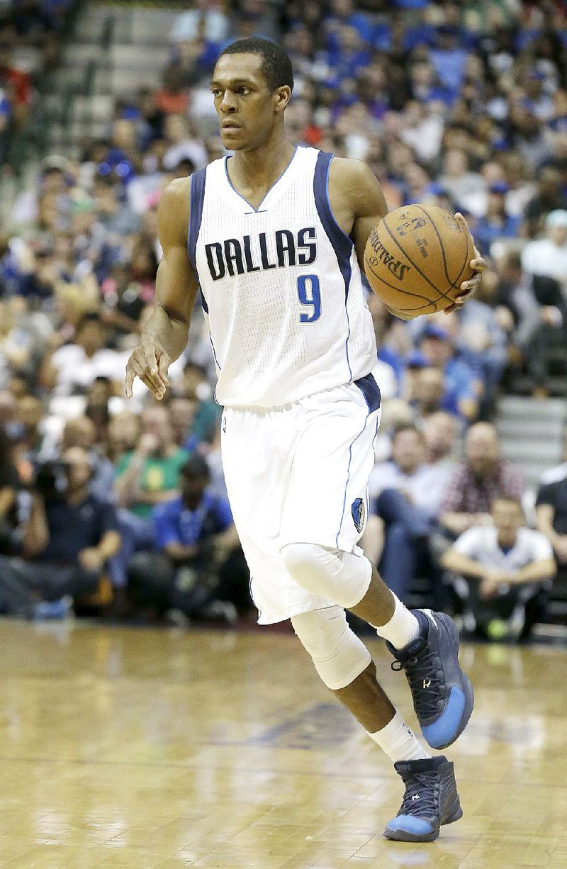 Dallas Mavericks guard Rajon Rondo (9) dribbles during the first half of an NBA basketball game against the Portland Trail Blazers Wednesday, April 15, 2015, in Dallas. (AP Photo/LM Otero)