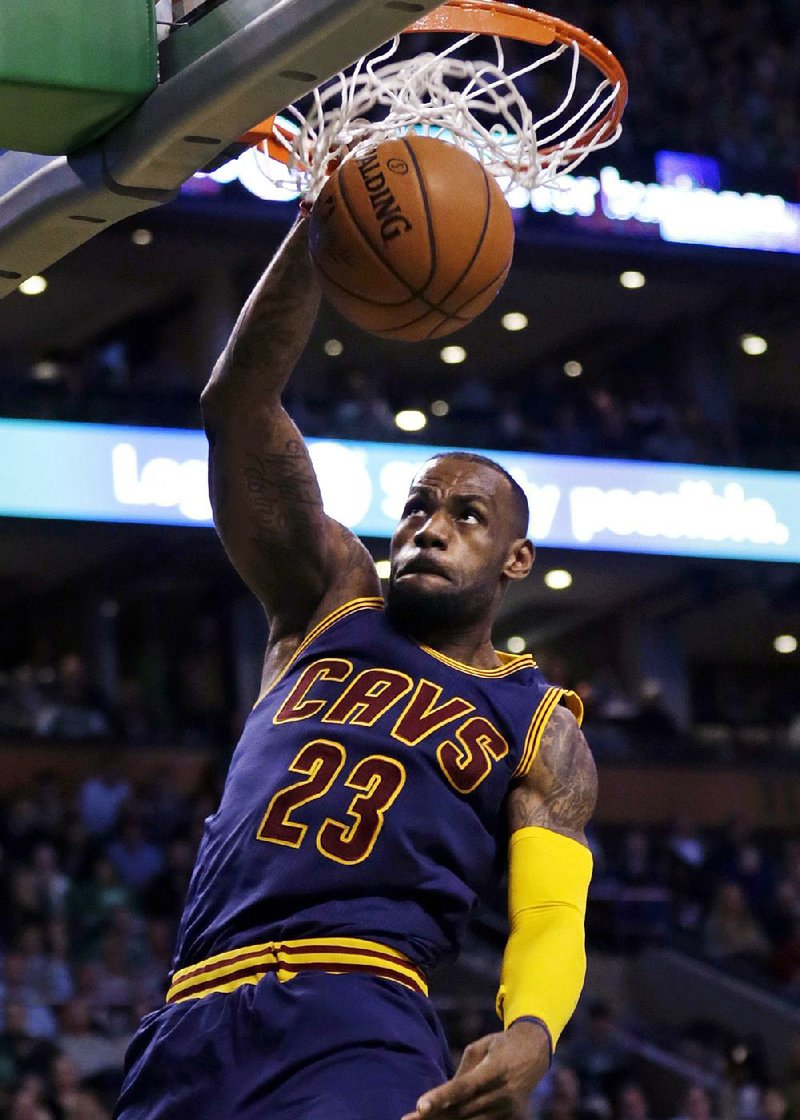 Cleveland Cavaliers forward LeBron James slams a dunk against the Boston Celtics during the second half of a first-round NBA playoff basketball game in Boston, Thursday, April 23, 2015. James had 31 points as the Cavaliers defeated the Celtics 103-95, taking a 3-0 lead in the series. (AP Photo/Charles Krupa)