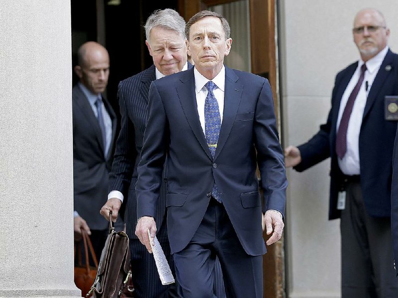 Former CIA Director David Petraeus leaves the federal courthouse in Charlotte, N.C., Thursday, April 23, 2015 after pleading guilty to sharing top government secrets with his biographer. Petraeus, whose career was destroyed by an extramarital affair with his biographer, was sentenced Thursday to two years' probation and fined $100,000 for giving her classified material while she was working on the book. (AP Photo/Chuck Burton)