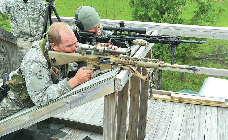 NWA Democrat-Gazette/Michael Woods &#8226; @NWAMICHAELW The sniper team of Sgt. Michael Carrasco (right) and Staff Sgt. Jim Anders, both with the Colorado National Guard, get ready to fire at their target during Thursday&#8217;s sniper competition at Fort Chaffee near Fort Smith. Twenty-three sniper teams are competing in the national Winston P. Wilson Sniper Championship through Friday at Fort Chaffee. Sniper teams include participants from Germany, Canada, Denmark, the U.S. National Guard and the active-duty Army and Marine Corps personnel. For photo galleries, go to nwadg.com/photos.