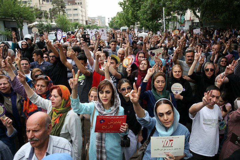 Iranian Armenians shout slogans against Ottoman Turks as they stage a protest near the Turkish embassy in Tehran to mark the 100th anniversary of the 1915 Armenian genocide in Antelias, Tehran, Iran, on Friday, April 24, 2015. 