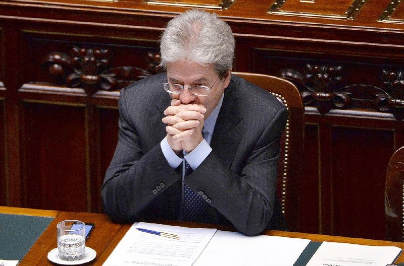 Italian Foreign Minister Paolo Gentiloni listens to opposition lawmakers at the Lower Chamber in Rome, Friday, April 24, 2015. Italy said Friday it wanted more information from the United States about how an Italian aid worker was killed in a U.S. drone strike on the Afghan-Pakistan border as officials sought to explain why it took three months to be told about the "tragic error." Foreign Minister Paolo Gentiloni told Parliament in a hastily scheduled briefing that in an inaccessible war zone, where hostage-taking is frequent, it took that long for U.S. intelligence to verify Giovanni Lo Porto had been killed. (Maurizio Brambatti/ANSA via AP Photo)
