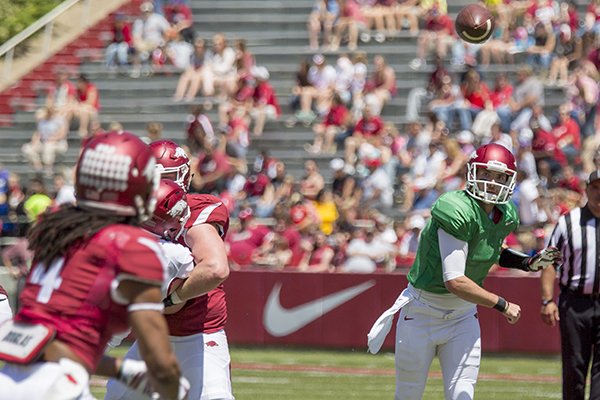 Arkansas quarterback Brandon Allen, right, throws a oass to wide receiver Keon Hatcher (4) during the Razorback's spring NCAA college football game Saturday, April 25, 2015, in Fayetteville, Ark. (AP Photo/Gareth Patterson)