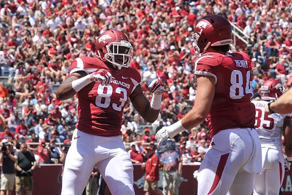 Arkansas tight end Jeremy Sprinkle (83) celebrates with Hunter Henry after catching a touchdown pass during the Razorbacks' spring game Saturday, April 25, 2015, at Razorback Stadium in Fayetteville. 