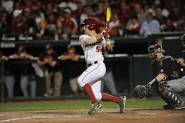 Arkansas shortstop Brett McAfee records a hit during the seventh inning of a game against Mississippi State on Saturday, April 25, 2015, at Baum Stadium in Fayetteville. 