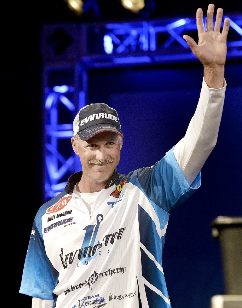 NWA Democrat-Gazette/BEN GOFF -- 04/25/15 Andy Morgan, FLW Pro from Dayton, Tenn., takes the stage during weigh-in on day three of the Walmart FLW Tour at Beaver Lake on Saturday Apr. 25, 2015 at the John Q. Hammons Center in Rogers. Morgan maintained his lead with a three-day total weight of 39 lbs. 2 oz. 