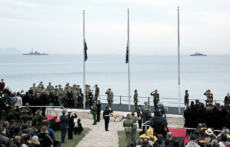 People attend the Dawn Service ceremony at the Anzac Cove commemorative site, in Gallipoli peninsula, Turkey, early Saturday, April 25, 2015. Anzac Cove is a small cove on the Gallipoli peninsula and the site of World War I landing of the ANZACs (Australian and New Zealand Army Corps) on April, 25, 1915. As dawn broke, families of soldiers, leaders and visitors gathered near former battlefields, honoring thousands of Australians and New Zealanders who fought in the World War I Gallipoli campaign on the 100th anniversary of the ill-fated British-led invasion. (AP Photo/Lefteris Pitarakis)