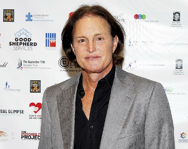 FILE - In this Sept. 11, 2013 file photo, former Olympic athlete Bruce Jenner arrives at the Annual Charity Day hosted by Cantor Fitzgerald and BGC Partners, in New York. ABC 's Diane Sawyer will interview the former Olympic champion and patriarch of the Kardashian television clan in a two-hour interview airing on Friday, April 24. (Photo by Mark Von Holden/Invision/AP, File)