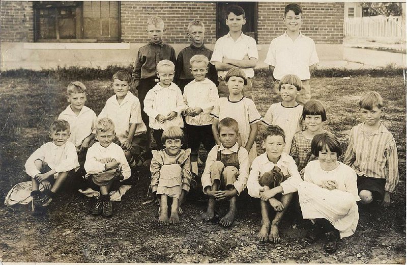 Special the the Arkansas Democrat-Gazette - 04/16/2015 - UPDATED CAPTION - Nine sets of twins at the former Clendenin School in North Little Rock, shown in a 1924 photo republished last week, were identified in the Arkansas Democrat on Sept. 28, 1924. According to the newspaper caption, the twins were, left to right: Bottom row: Vohn and John Bickers, Marie and Morris Moore, and Jessie and Bessie Clements. Middle row: W.M. and Woodrow Burks, Herbert and Herman Couthron, Gladys and Gertrude Alford and Martha and Henry Voss. Back row: Rayburn and Raymond Medlock and Glen and Ben Quinney. The Quinneys were the only ones identified in last week's photo, but as being Ben on the left, Glen on the right.