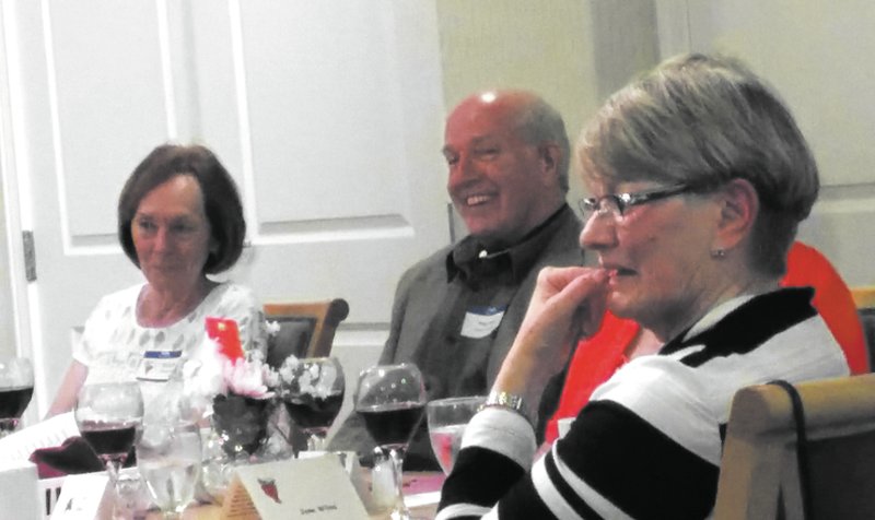 Courtesy Photo With her hand to her face, Jane Wilms, also known as Penny Penot, seems tense at &#8220;A Taste of Wine and Murder&#8221; dinner held at the Plaza at Highlands Crossing April 19. At the table with her from the left are Mary Kennedy and Mayor Peter Christy or Papa Vito. The mystery dinner was a fundraiser for the Bella Vista Library expansion. Marilyn Frisby, who came up with the fundraising idea, says in addition to money from ticket sales, an anonymous donor gave $10,000 for the expansion.