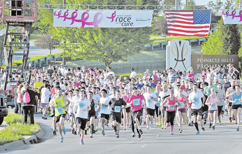 NWA Democrat-Gazette/BEN GOFF Runners start the competitive 5K run Saturday during the Komen Ozark Race for the Cure at Pinnacle Hills Promenade in Rogers. For photo galleries, go to nwadg.com/photos.