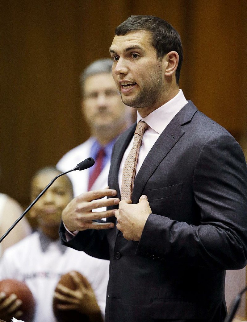 Indianapolis Colts quarterback Andrew Luck speaks to the House of Representatives at the Statehouse, Tuesday, April 21, 2015, in Indianapolis. Luck and experts from Riley Hospital for Children visited the Statehouse to meet with lawmakers and support a resolution that recognizes the success of his "Change the Play" initiative. (AP Photo/Darron Cummings)
