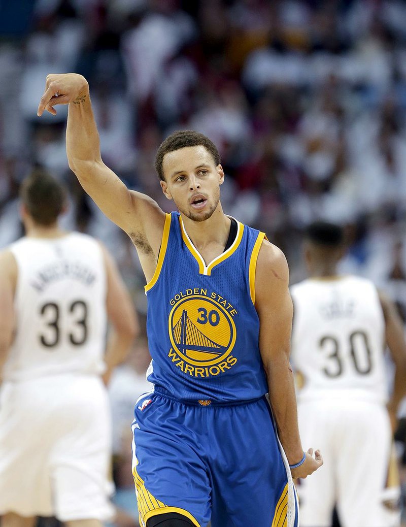 Golden State Warriors' Stephen Curry (30) reacts after hitting a 3-point basket during the second half of Game 4 of a first-round NBA basketball playoff series against the New Orleans Pelicans in New Orleans, Saturday, April 25, 2015. The Warriors won 109-98 to sweep the series. (AP Photo/Gerald Herbert)