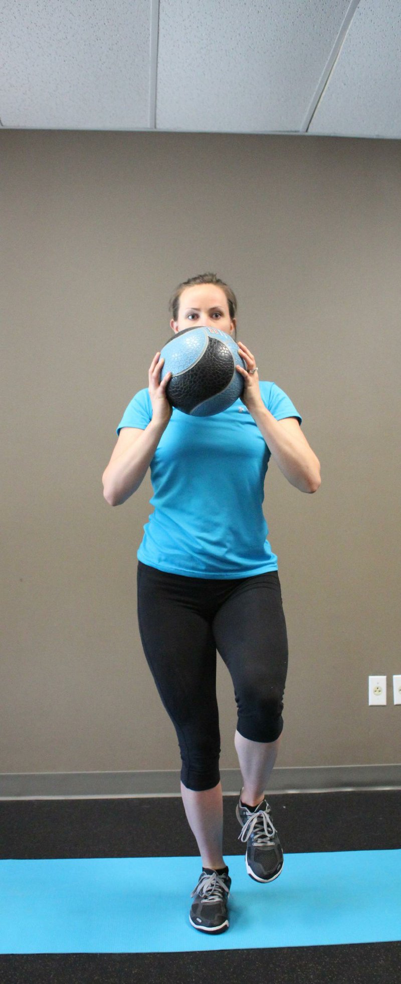 Arkansas Democrat-Gazette/CELIA STOREY
Anna Bolte does the first step of the Single Leg Hop Press exercise for Matt Parrot's Master Class exercise of the week column in ActiveStyle.