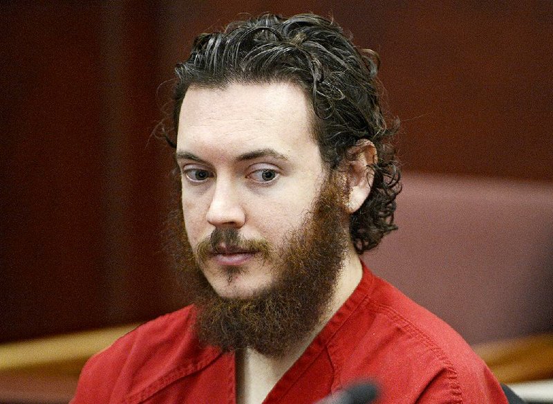 FILE - In this June 4, 2013 file photo, Aurora theater shooting suspect James Holmes is seated in court in Centennial, Colo. Holmes faces trial starting on April 27, 2015, in the mass shooting in an Aurora, Colo., movie theater that left 12 dead and 70 wounded. (Andy Cross, Pool via AP, file)